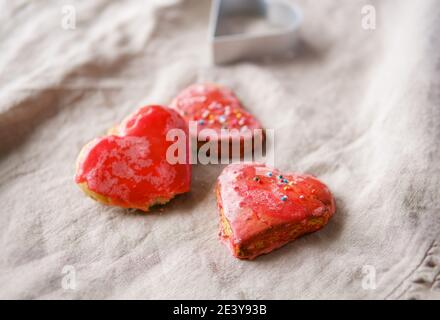 Heart shaped red hand made cookies . Valentine's day concept. Stock Photo