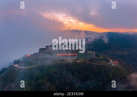 Visegrad, Hungary - Aerial panoramic drone view of the beautiful high castle of Visegrad on a moody winter morning. Stock Photo