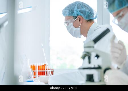 close up. scientist using a microscope in the laboratory. Stock Photo