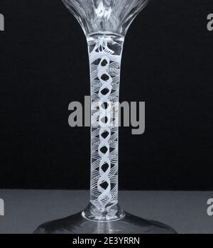 close up detail photograph of the twist in a Georgian Opaque twist stem wine glass Stock Photo