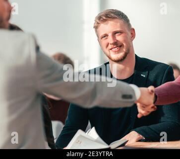 lucky applicant shaking hands with the employer during the interview Stock Photo
