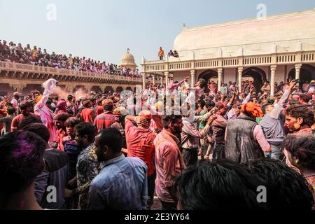 MATHURA, INDIA - Jan 01, 2021: People of mathura playing holi in the street of barsana and nandgaon, covered in holi colors, happy and festive concept Stock Photo