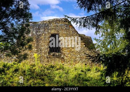 Lanckorona, Poland - August 27, 2020: Ruins of medieval royal Lanckorona Castle in historic royal open-air museum town in Beskidy mountains of Poland Stock Photo