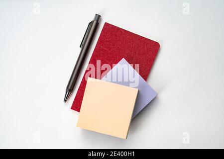Topview of notebook with pen and sticky note Stock Photo