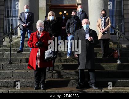 Relatives of the late Paddy McElhone including his sister Mary McCourt (front left) and his brother Michael McElhone (front right) stand outside Omagh courthouse after a coroner delivered the findings of an inquest into his death. A farmer shot dead in cold blood by the Army during the Northern Ireland conflict has been exonerated, his family said. Paddy McElhone, 24, died instantly near his home in Pomeroy, Co Tyrone, in 1974 after he was fired on by a soldier from the First Battalion, the Royal Regiment of Wales. Stock Photo