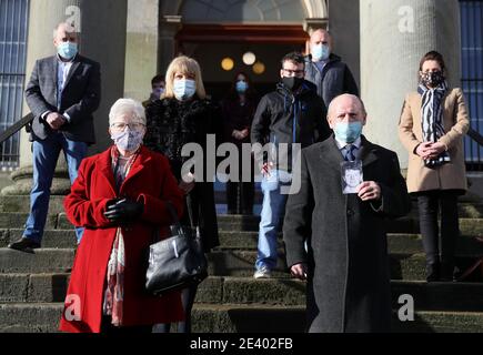 Relatives of the late Paddy McElhone including his sister Mary McCourt (front left) and his brother Michael McElhone (front right) stand outside Omagh courthouse after a coroner delivered the findings of an inquest into his death. A farmer shot dead in cold blood by the Army during the Northern Ireland conflict has been exonerated, his family said. Paddy McElhone, 24, died instantly near his home in Pomeroy, Co Tyrone, in 1974 after he was fired on by a soldier from the First Battalion, the Royal Regiment of Wales. Stock Photo