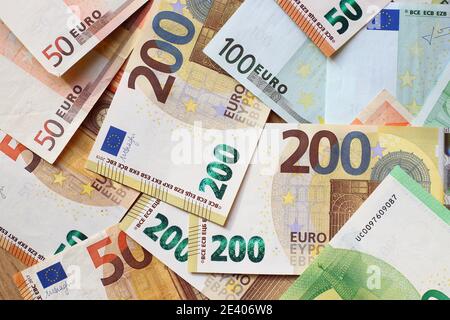 Euro currency banknotes texture. European paper money texture with 50, 100 and 200 euros bills. Stock Photo