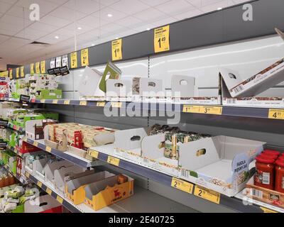 KATOWICE, POLAND - MARCH 14, 2020: Empty supermarket shelf in a grocery store in Poland. Local people stockpiled food in anticipation of Coronavirus ( Stock Photo