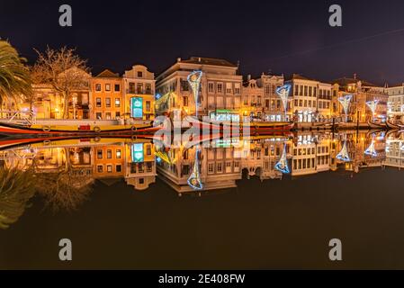 color image of the river with Moliceiro boats on the lagoon at night, northern, Aveiro, Portugal January 2021 Stock Photo