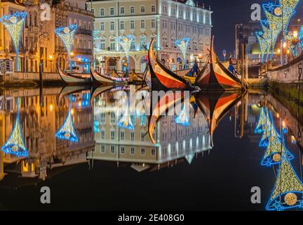 color image of the river with Moliceiro boats on the lagoon at night, northern, Aveiro, Portugal January 2021 Stock Photo