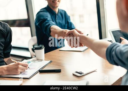 close up. business partners confirming the transaction with a handshake. Stock Photo