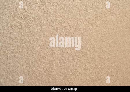 cream cement wall in building background and texture Stock Photo