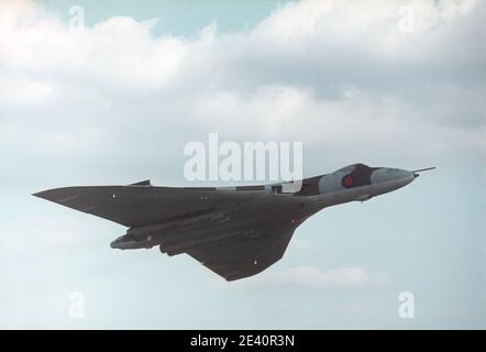 1975 RAF Finningley air display airshow 1975 The Avro Vulcan later Hawker Siddeley Vulcan bomber is a jet-powered tailless delta wing high-altitude strategic bomber, which was operated by the Royal Air Force (RAF) from 1956 until 1984. This is a Strategic bomber or Vulcan bomber XM597 flying at Finningley Air Show in 1975 The photo is taken 20 Sep 1975 at an air show at  RAF Finningley airfield Doncaster South Yorkshire England UK GB Europe. This Vulcan Bomber XM597 is on display at the national museum of flight, East Fortune near Edinburgh Scotland UK Stock Photo