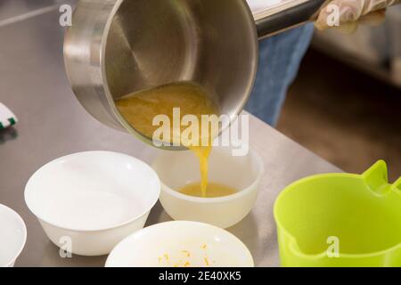 The process of making jelly from natural fruits. Heated fresh citrus fruit  juice with sugar and agar Stock Photo - Alamy