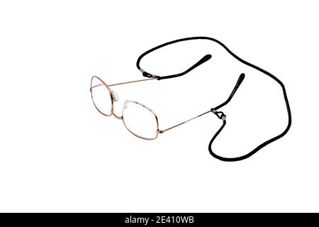 Horizontal shot of a pair of reading glasses with a black neck cord on a white background with copy space. Stock Photo