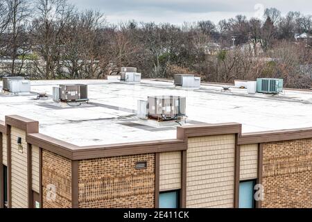 Horizontal shot of rooftop air conditioning units on top of a medical office building. Stock Photo