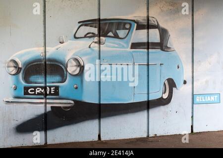 A graffiti style painting of a three wheeled Reliant car on an underpass next to the river Tame in Tamworth. Reliant were a motor car company based in Tamworth. The company ceased to exist in 2002 and the site of the Reliant factory is now a housing estate. The company were well known for their unusual three wheeled vehicles. Stock Photo