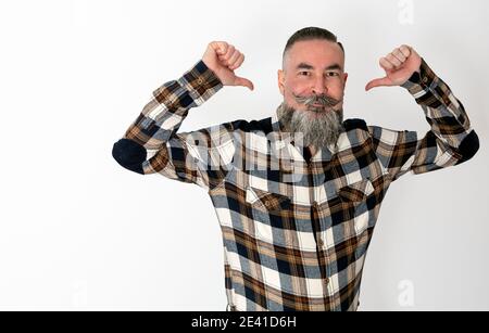 Bearded hipster retro style, plaid shirt raising arms and pointing to