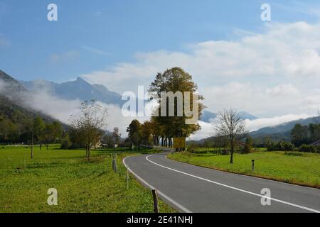 Low clouds in the autumn landscape along the road leading from the Italian border to Kobarid in the Slovene Littoral or Primorska region of W Slovenia Stock Photo