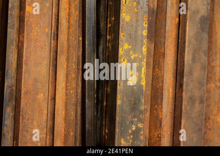 Vertical line pattern from metal rusted flat bars for background Stock Photo