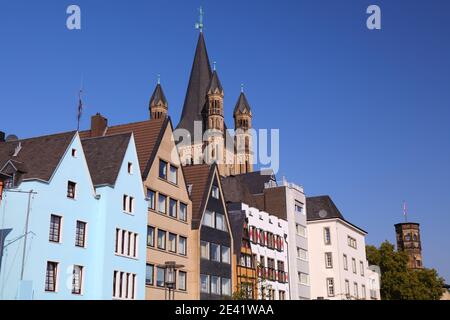 Cologne Old Town, Germany. Colorful architecture of Frankenwerft and Great Saint Martin Church. Stock Photo