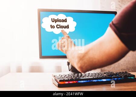 Upload to cloud on the computer screen - backing up data in the cloud storage Stock Photo