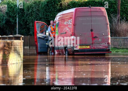 A Parcelforce delivery van is stranded in flood water in Hereford as ...