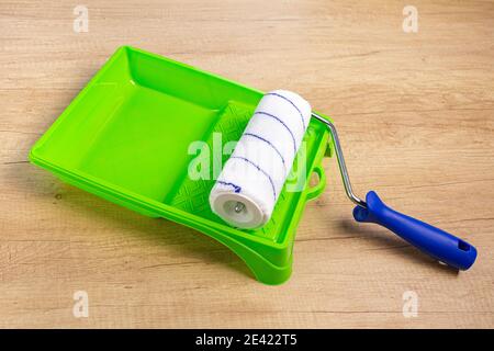 Blue Plastic Paint Pan and a Paint Roller Stock Image - Image of