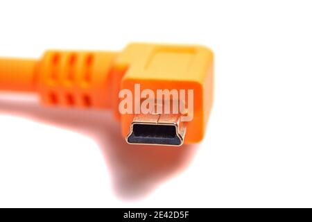 Orange USB cable isolated on white background. Stock Photo