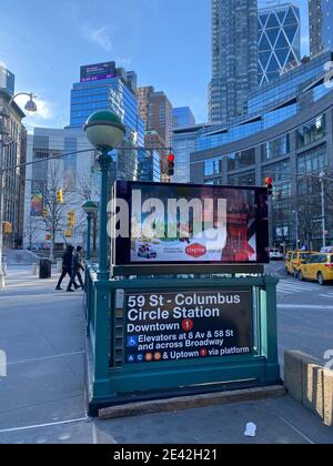 Subway train entrance on a pedestrian island at Columbus Circle by Central Park on the Westside of Manhattan, New York City. Stock Photo