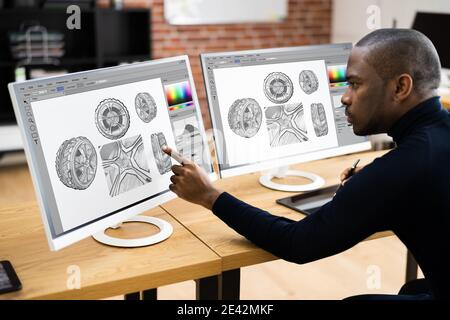 African American Man Using Graphic Tablet Painting On Screen Stock Photo