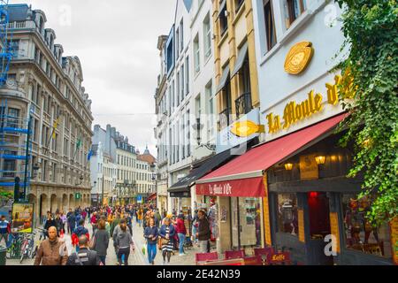 BRUSSELS, BELGIUM - OCTOBER 06, 2019: Crowd of people walking by Old Town shopping street of Brussels Stock Photo