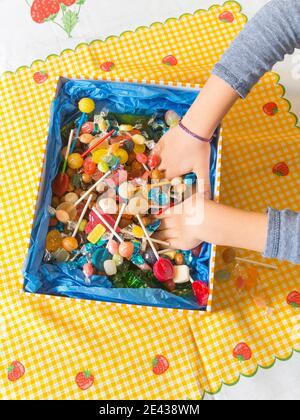 Hands Holding A Box Of Assorted Sweets Foodcollection Stock Photo - Alamy