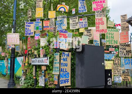 Thank you NHS sign paintings hang on fence in London park in roman road, England Stock Photo