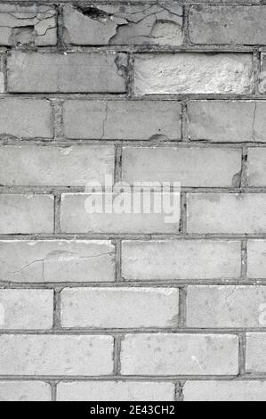 White light grey old aged weathered fine brick wall texture, grungy damaged calcium silicate bricks pattern detail background macro closeup, large Stock Photo