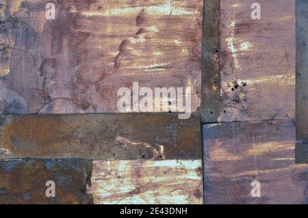 Old aged weathered rusty corroded coat iron sheets texture pattern, multiple horizontal rusted corroding grunge metal patch plates, rustic background Stock Photo