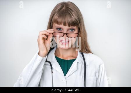 Portrait of successful doctor with stethoscope isolated on white background Stock Photo