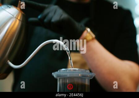 Hands holding hot water to prepare coffee Stock Photo
