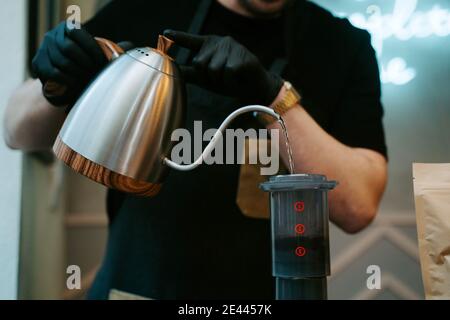 Hands holding hot water to prepare coffee Stock Photo