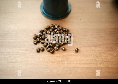 Closeup of some coffee beans on a table Stock Photo