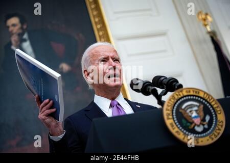 Washington, DC, USA. 21st Jan, 2021. U.S. President Joe Biden speaks on his administration's Covid-19 response in the State Dining Room of the White House in Washington, DC, U.S., on Thursday, Jan. 21, 2021. Biden in his first full day in office plans to issue a sweeping set of executive orders to tackle the raging Covid-19 pandemic that will rapidly reverse or refashion many of his predecessor's most heavily criticized policies. Credit: Al Drago/Pool via CNP | usage worldwide Credit: dpa/Alamy Live News Stock Photo