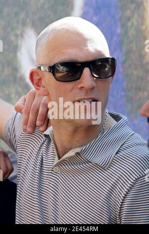 A bald Vincent Cassel poses at the Majestic hotel during the 62nd