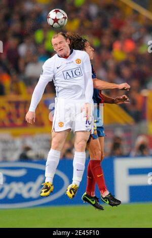 Barcelona's Carles Puyol battles for the ball with Manchester United's Wayne Rooney during the UEFA Champion League Final soccer match, Barcelona FC vs Manchester United at the Stadio Olimpico in Rome, Italy on May 27, 2009. Barcelona Won 2-0. Photo by Henri Szwarc/ABACAPRESS.COM Stock Photo