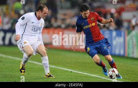 Manchester United's Wayne Rooney and Barcelona's Lionel Messi battle for the ball during the UEFA Champion League Final soccer match, Barcelona FC vs Manchester United at the Stadio Olimpico in Rome, Italy on May 27, 2009. Barcelona Won 2-0. Photo by Steeve McMay/ABACAPRESS.COM Stock Photo