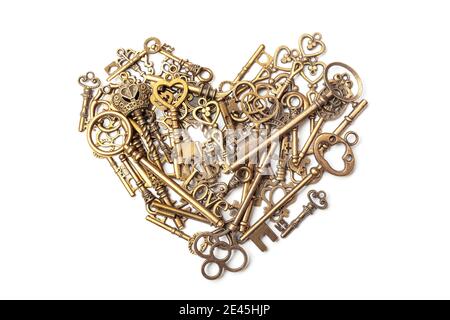 Old, vintage keys in the shape of a heart isolated on white bacground Stock Photo