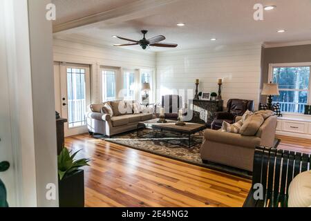 A new addition of an updated living room and den with pine hardwood floors Stock Photo