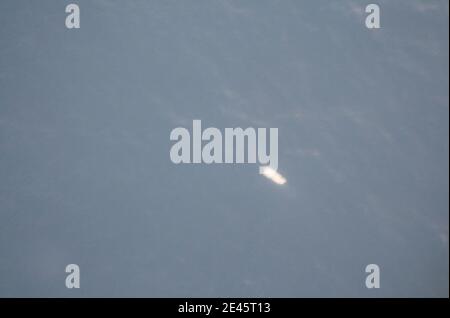 In this photo released by Brazil's Air Force, a Brazilian Navy ship, bottom center, approaches debris, right, that Brazilian authorities believe are from Air France Flight 447 in the Atlantic Ocean, on June 6, 2008. Three more bodies were found Sunday in the ocean near the spot where an Air France jet is believed to have crashed a week ago, bringing the total number of bodies plucked from the water to five, Brazil's military said. At left, a colored smoke signal used by searchers to mark the spot where debris was found. Photo by Brazilian Air Force/ABACAPRESS.COM Stock Photo