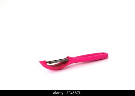 Pink vegetable peeler isolated on white background. Stock Photo