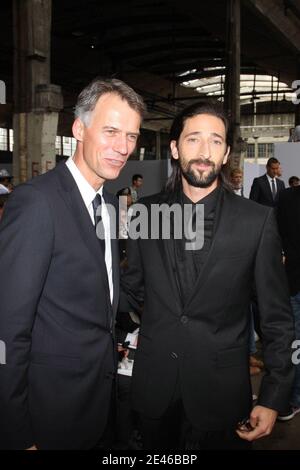 New CEO of Hugo Boss Claus-Dietrich Lahrs (L) with US actor Adrien Brody during Hugo Boss the men's 2009-2010 spring-summer ready to wear (French PAP) collection show in Paris, France, on Juin 25, 2009. Photo by Benoit Pinguet/ABACAPRESS.COM Stock Photo