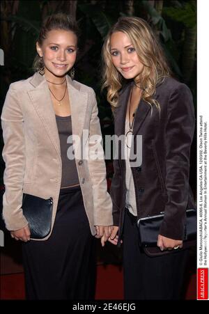 © Giulio Marcocchi/ABACA. 40395-6. Los Angeles-CA-USA. 12/03/02. Ashley and Mary-Kate Olsen (Twins) attend the Hollywood Reporter's Annual Women In Entertainment at the Beverly Hills Hotel. Stock Photo